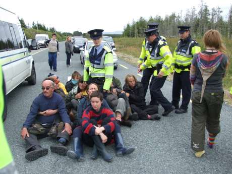Rolling blockade leading to Shell tractor reversing back into refinery