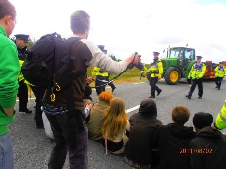 Click on image to see full-sized version the guards directing the tractor to drive off the road