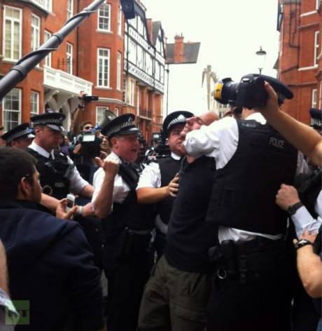 Click on image to see full-sized version Police Assault Assange Supporters.