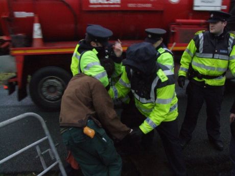 Click on image to see full-sized version Gardaí working hard for Shell. That gate is the entrance to the camp