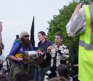 Entertaining the crowd with flute and drum